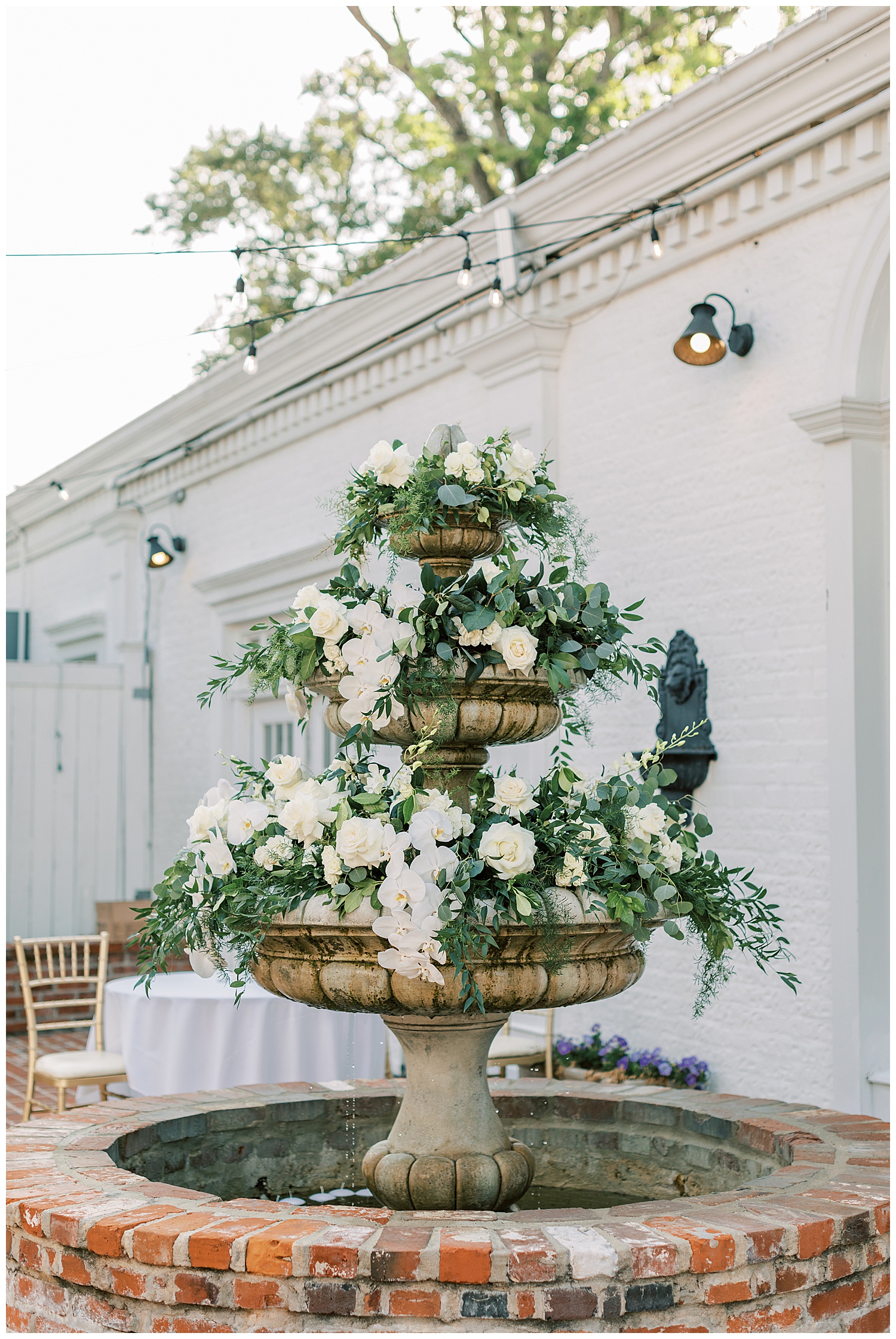 The Floral Cottage Florist designed this beautiful white and green floral fountain.