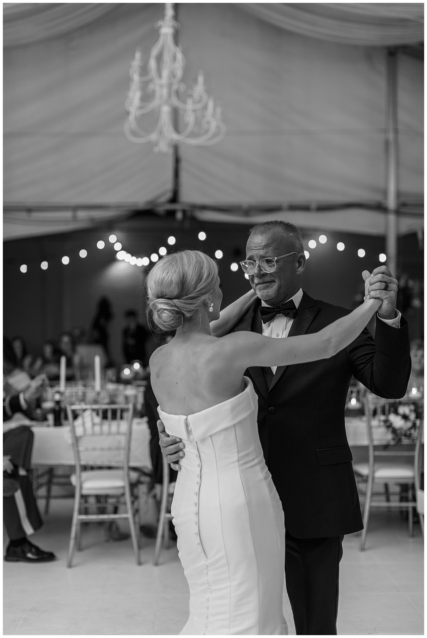 A bride dances with her father for the first time as a wife.