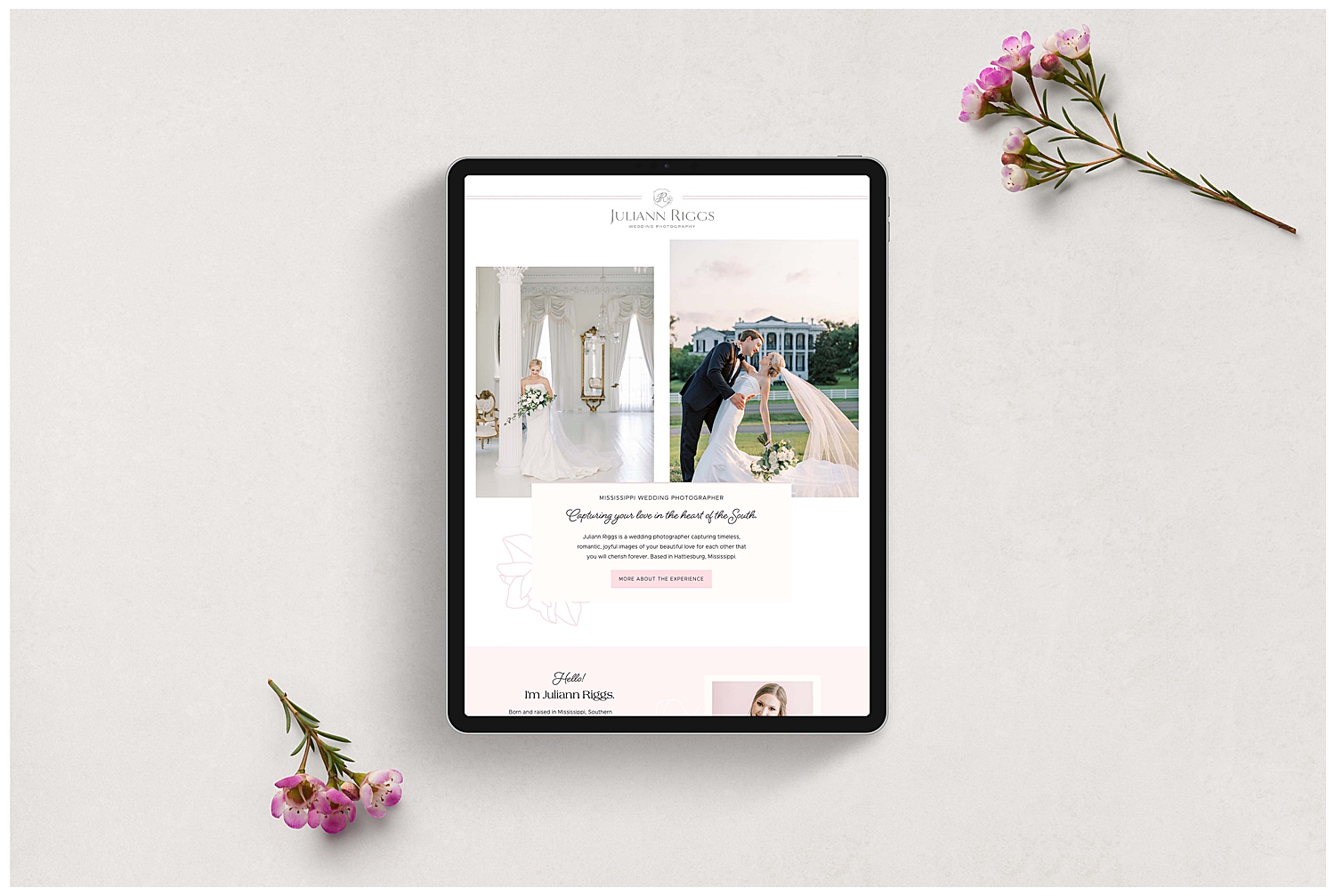An iPad sits on the table with Juliann Riggs Photograph's website pulled up.