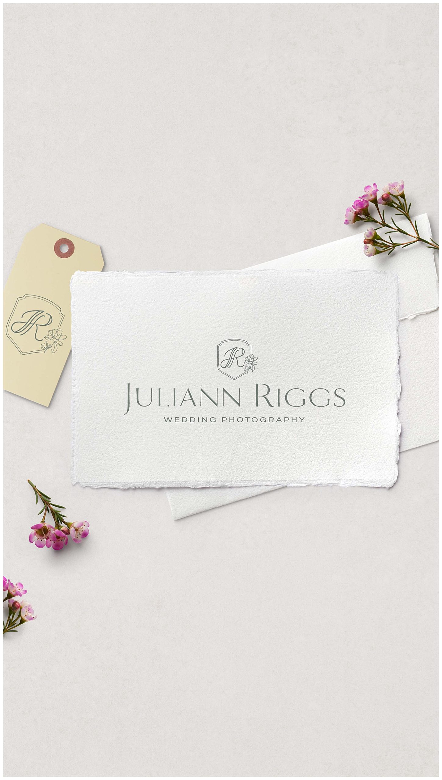 Flowers surround Juliann Riggs Photography's stationery.