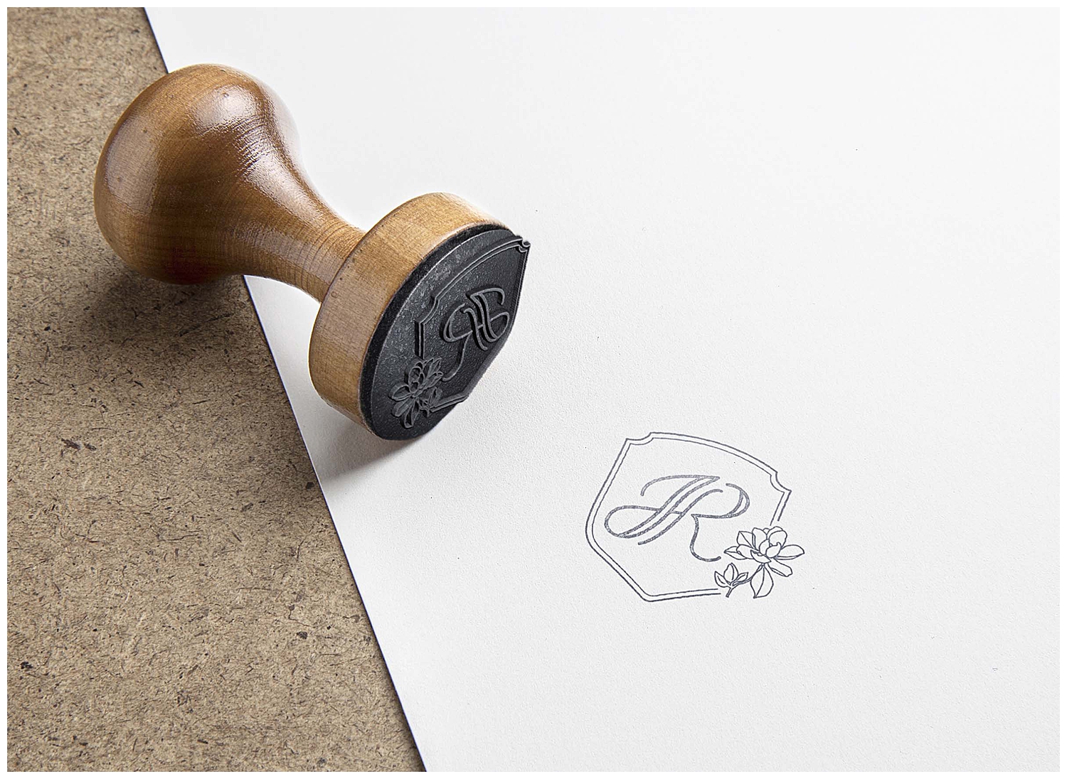 A stamp stamps the paper with Juliann Riggs Photography's crest on it.