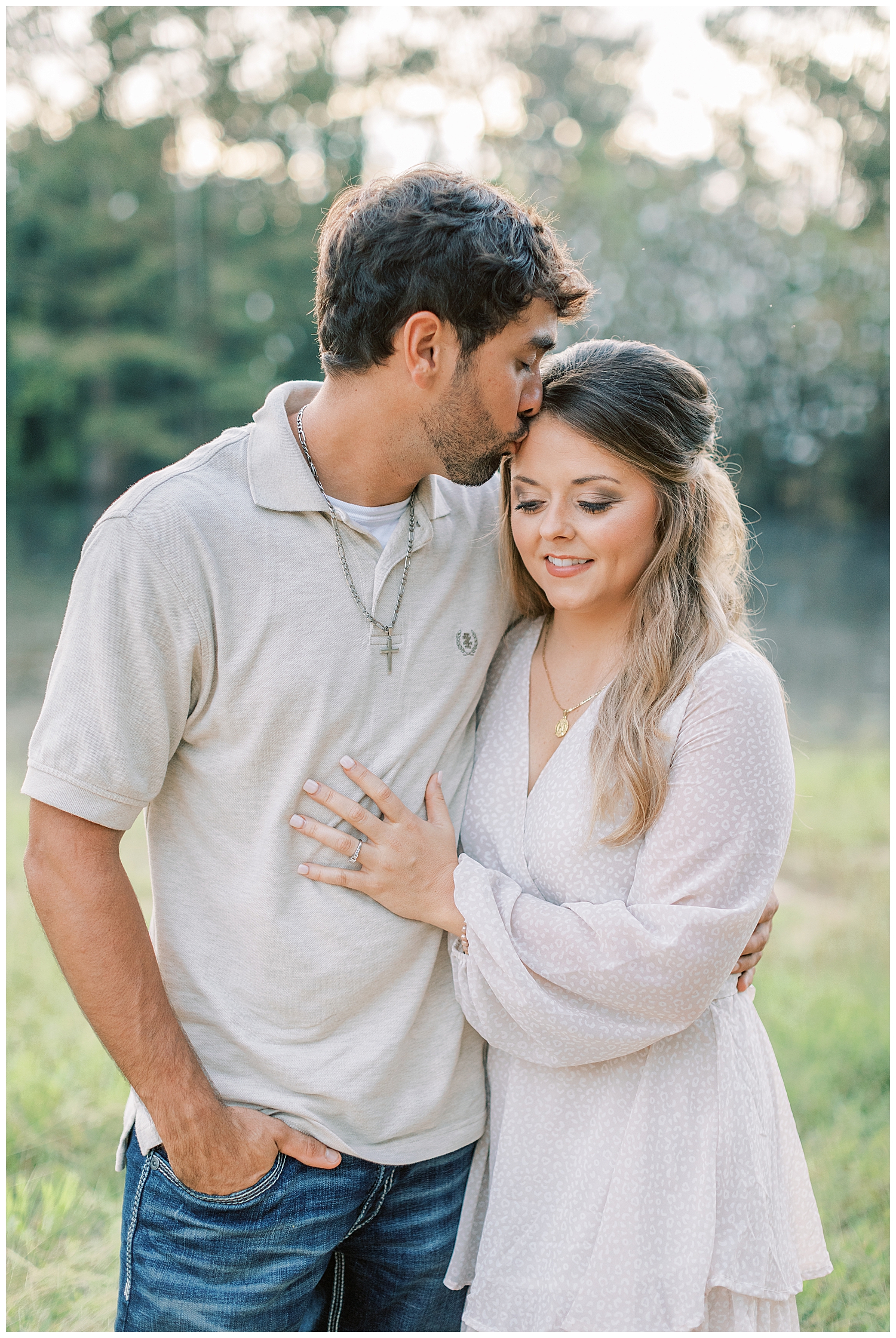 Juliann Riggs Photography captures a couple kissing in the summer engagement photos.