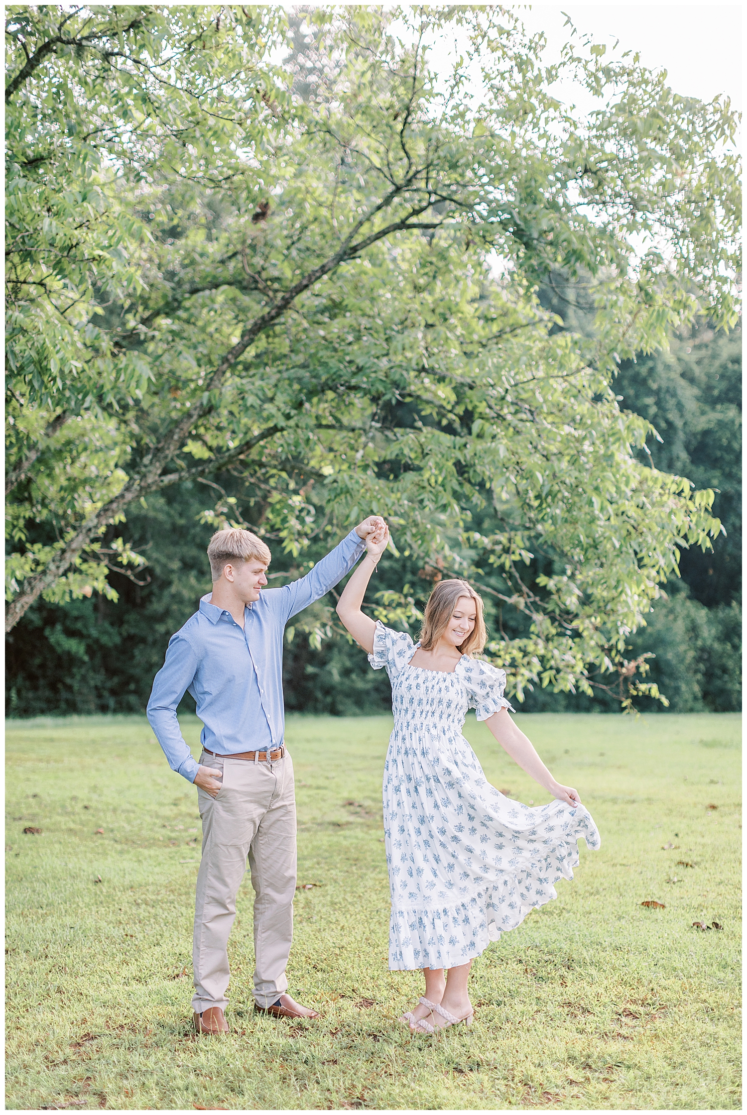 A couple dances together in the sunrise engagement photos.