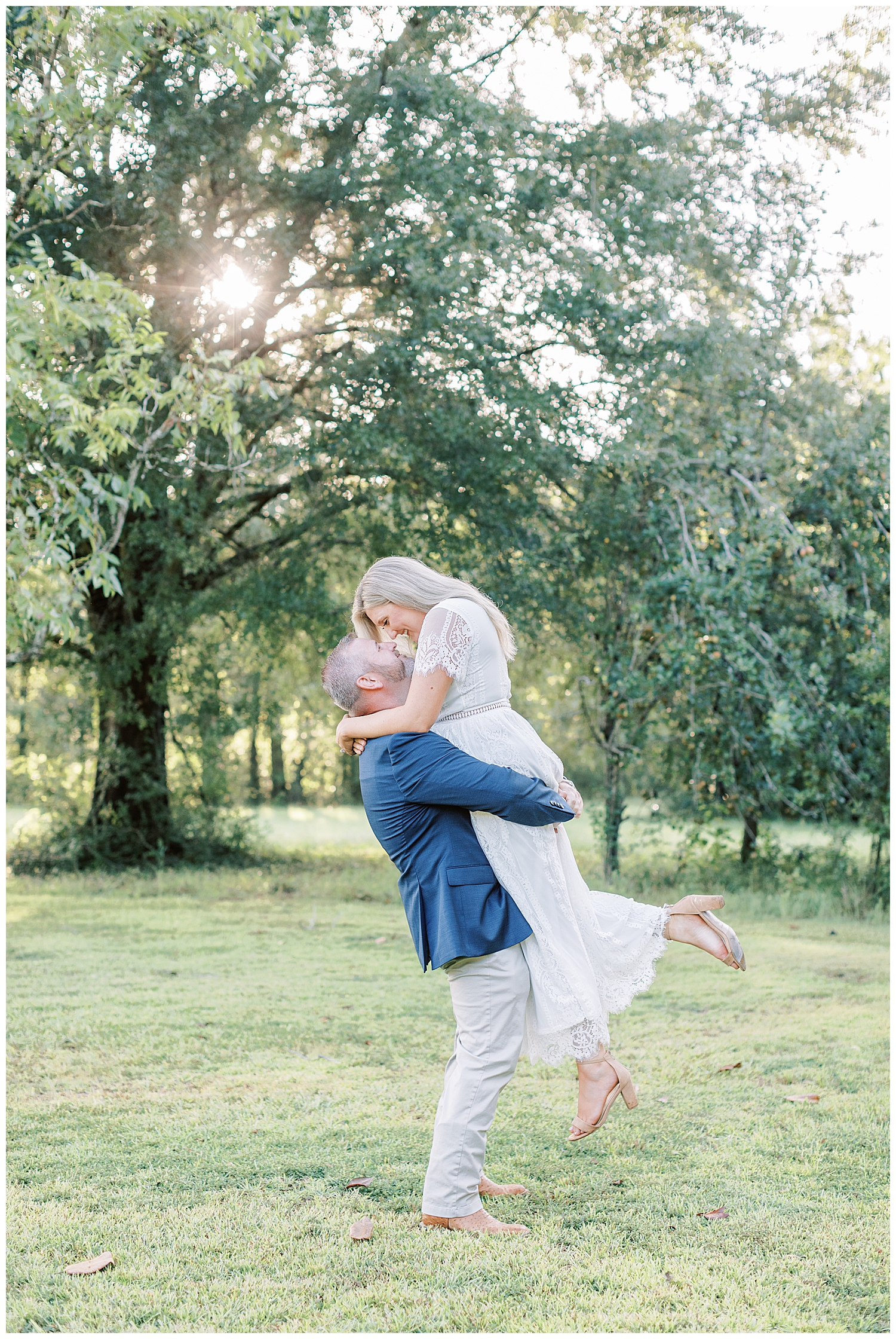 Juliann Riggs Photography captures engagement photos of a couple embracing each other.