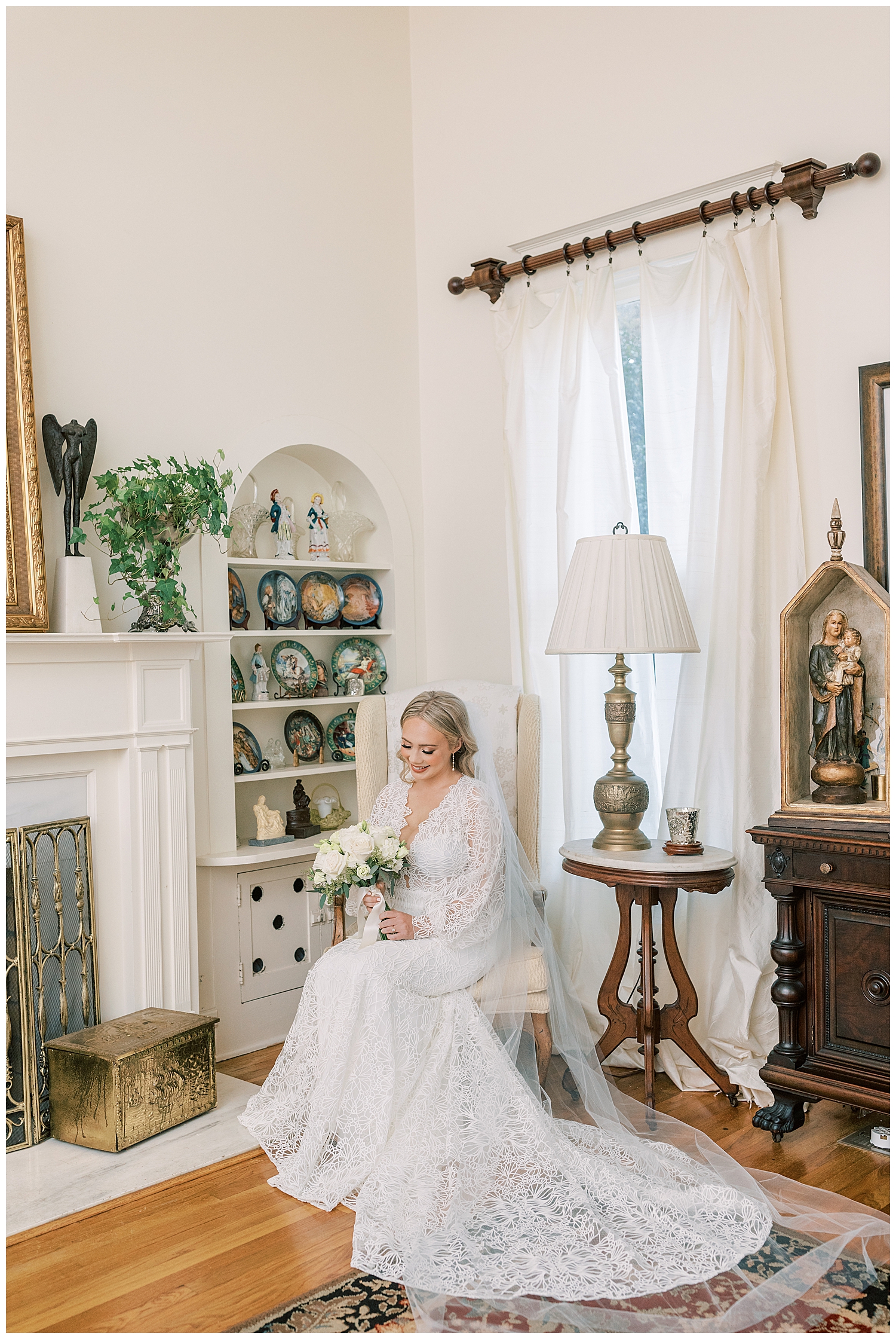 A bride sits in an antique chair.