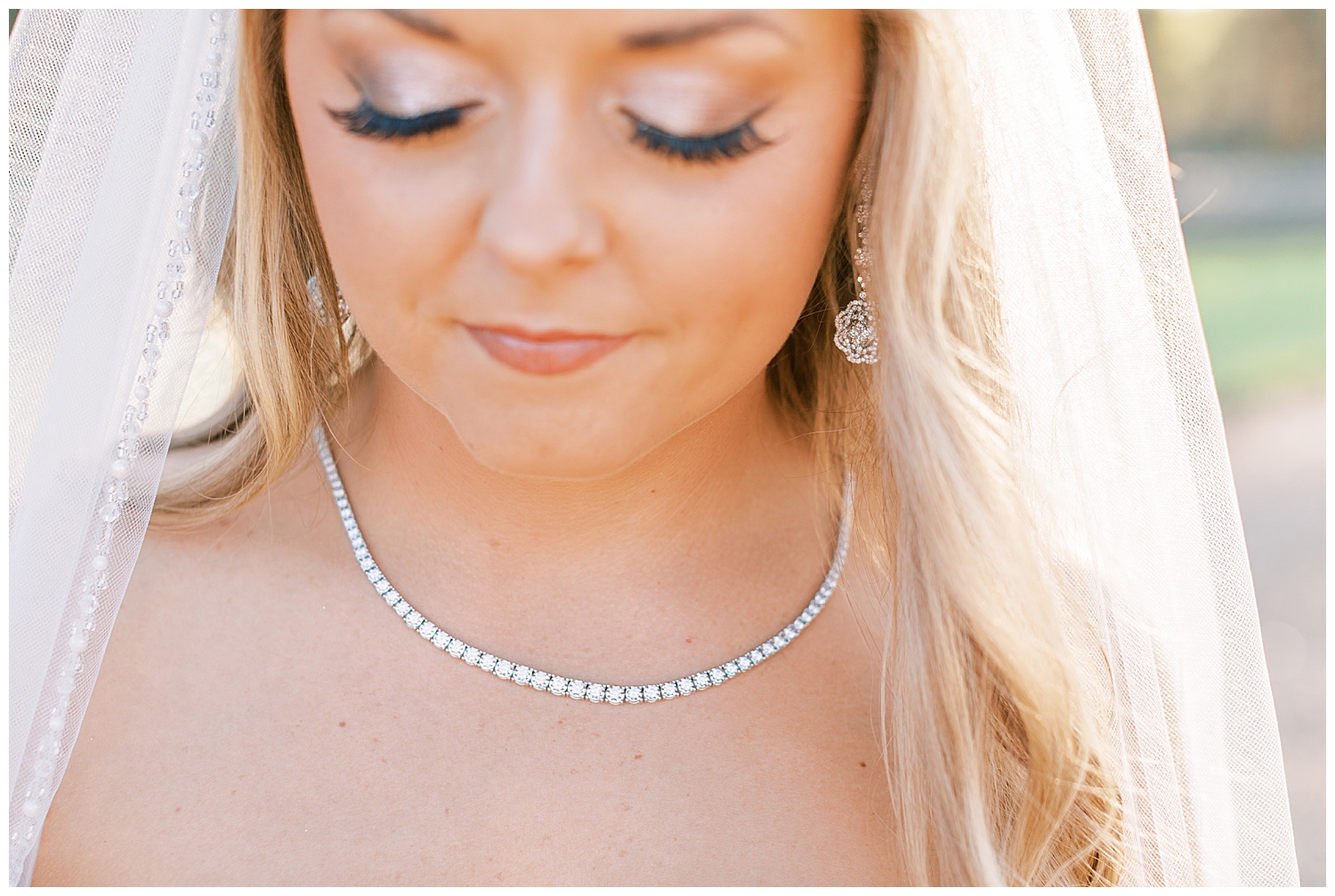 A bride wears a genuine diamond necklace.