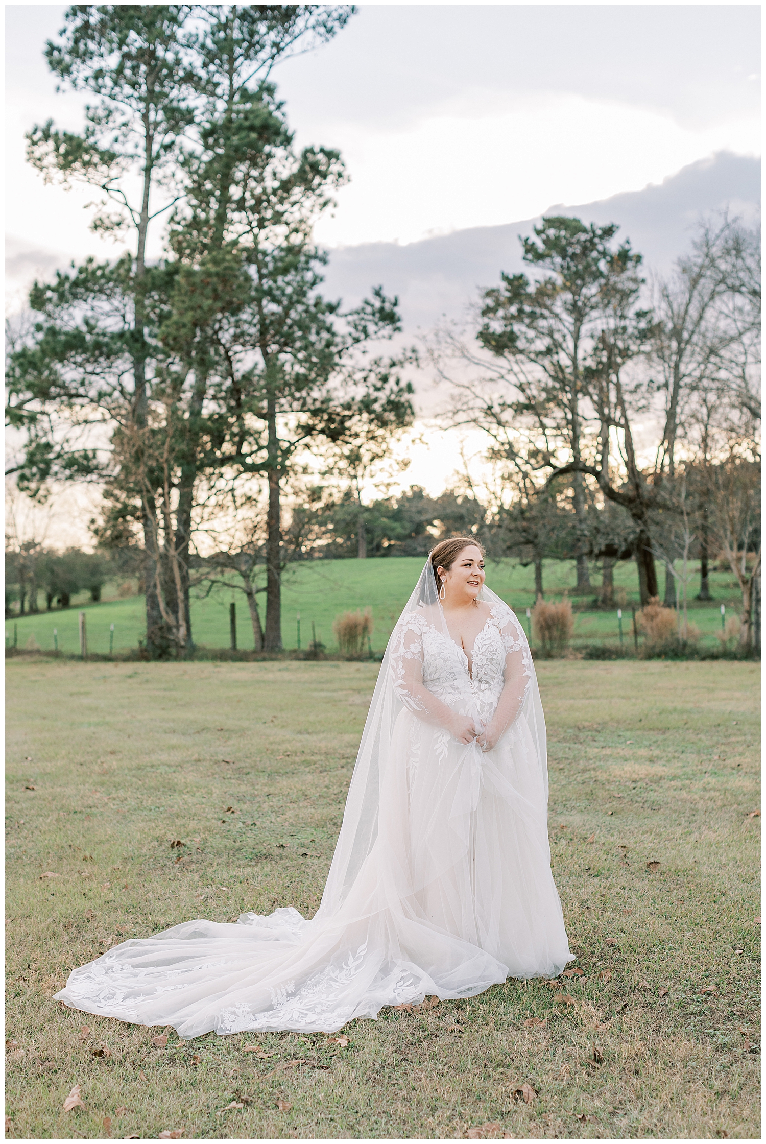 A bride smiles off into the distance.