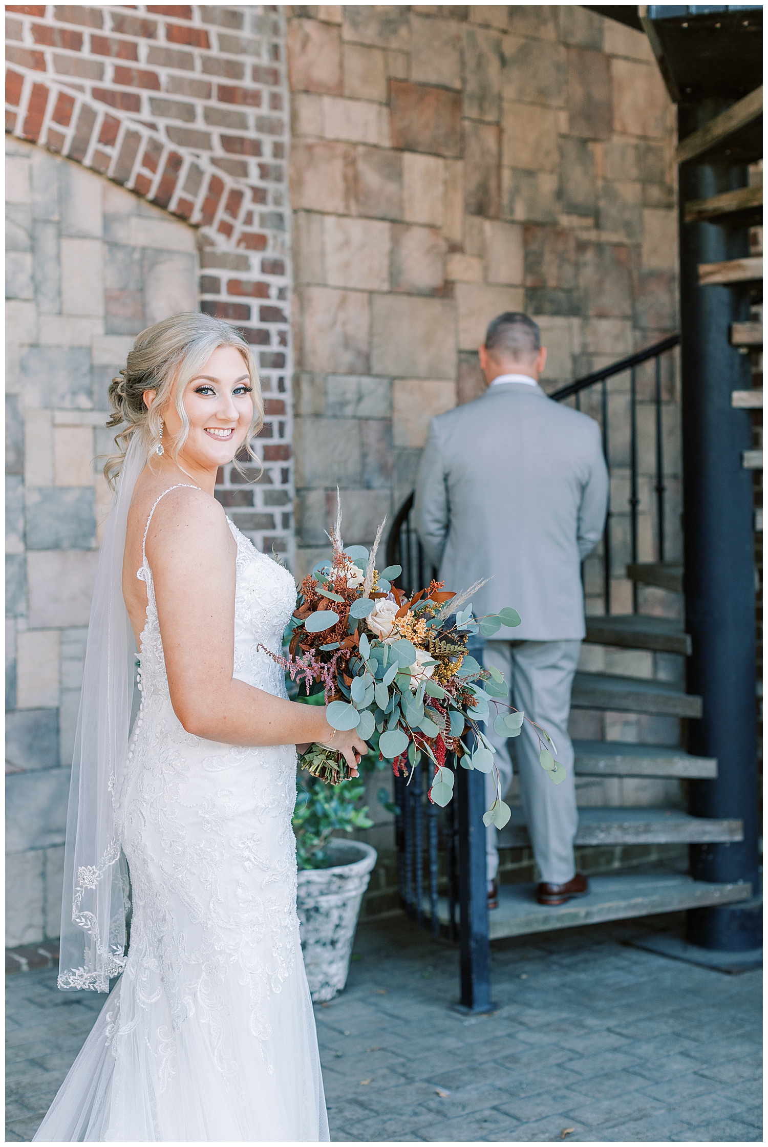 A bride looks over her shoulder at Three Lakes Manor in Poplarville.