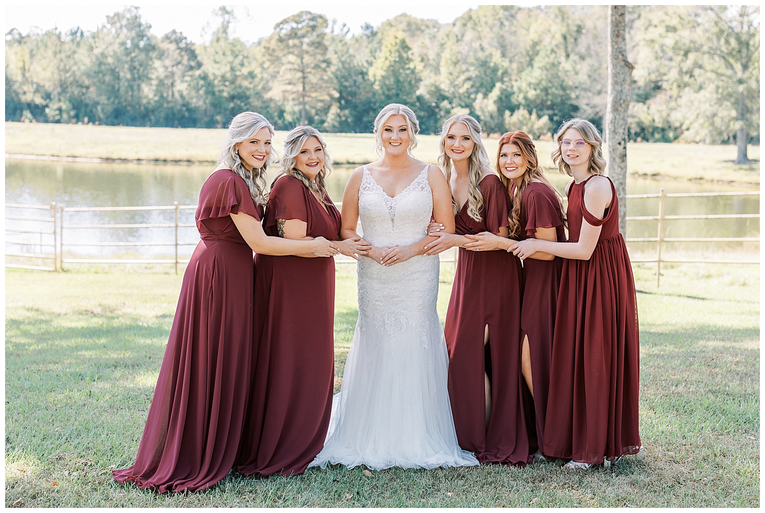 A bride stands with the bridesmaids at Three Lakes Manor in Poplarville.