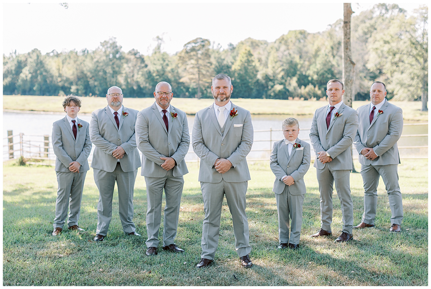 The groom and groomsmen stand in a diagonal.
