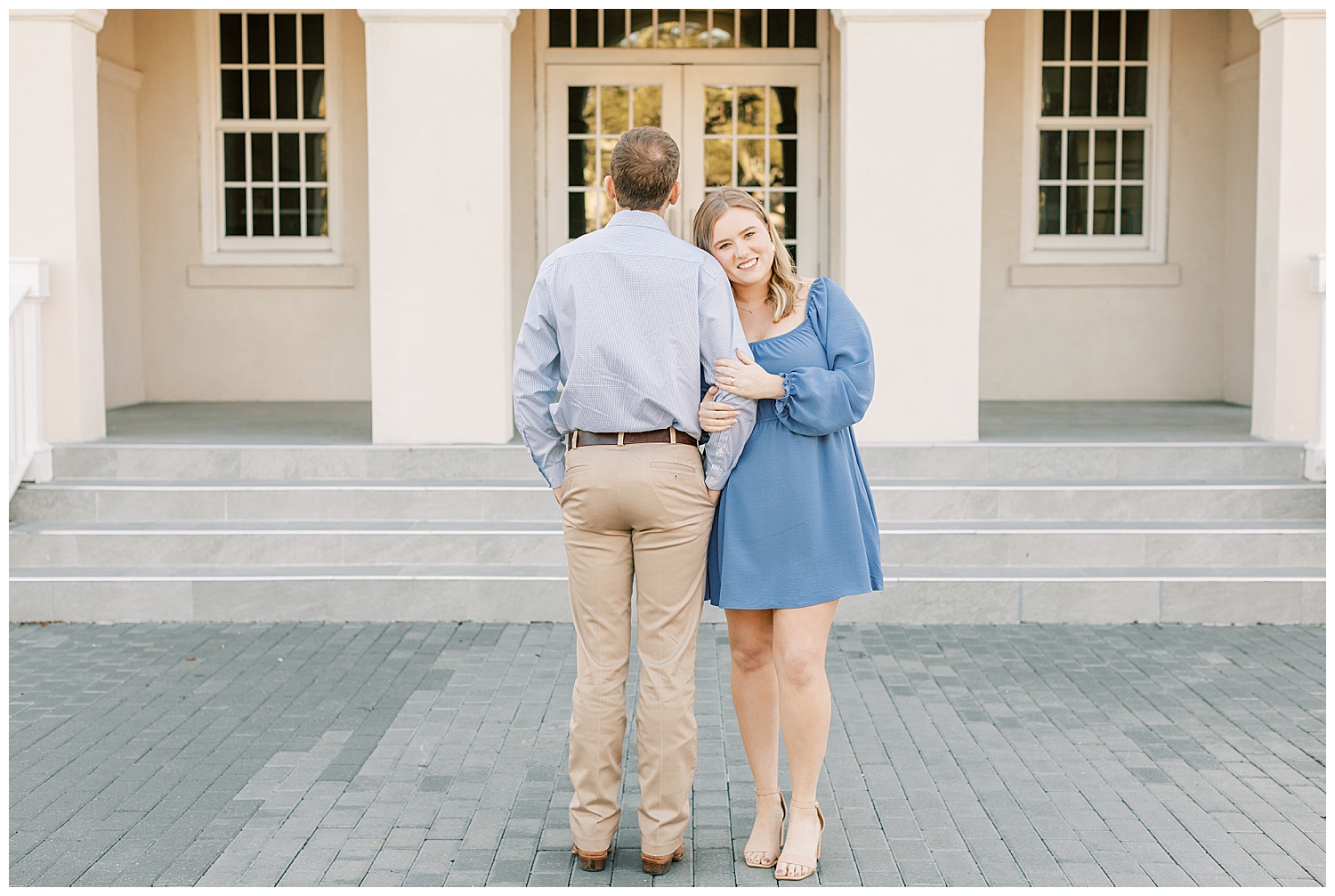 A couple takes engagement photos at Centennial Plaza in Gulfport.