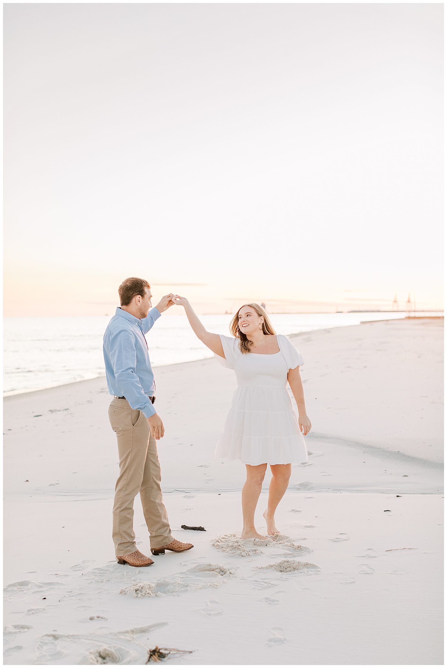 A couple dances on the beach in Gulfport.