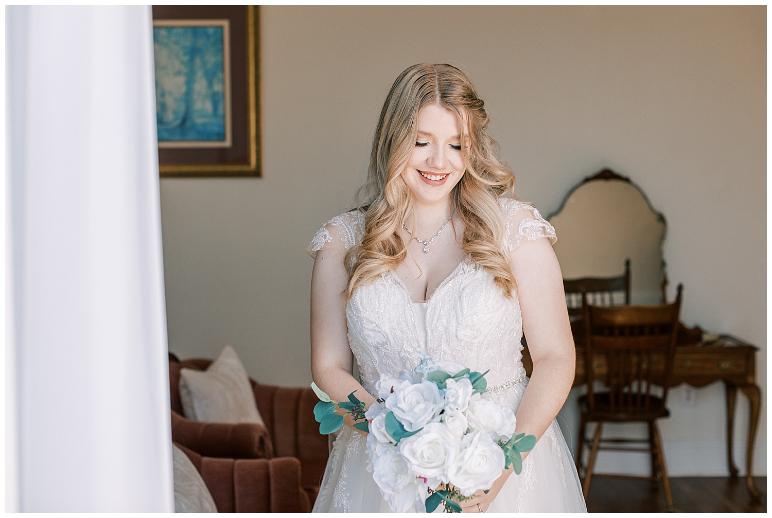 A bride smiles inside Three Lakes Manor.