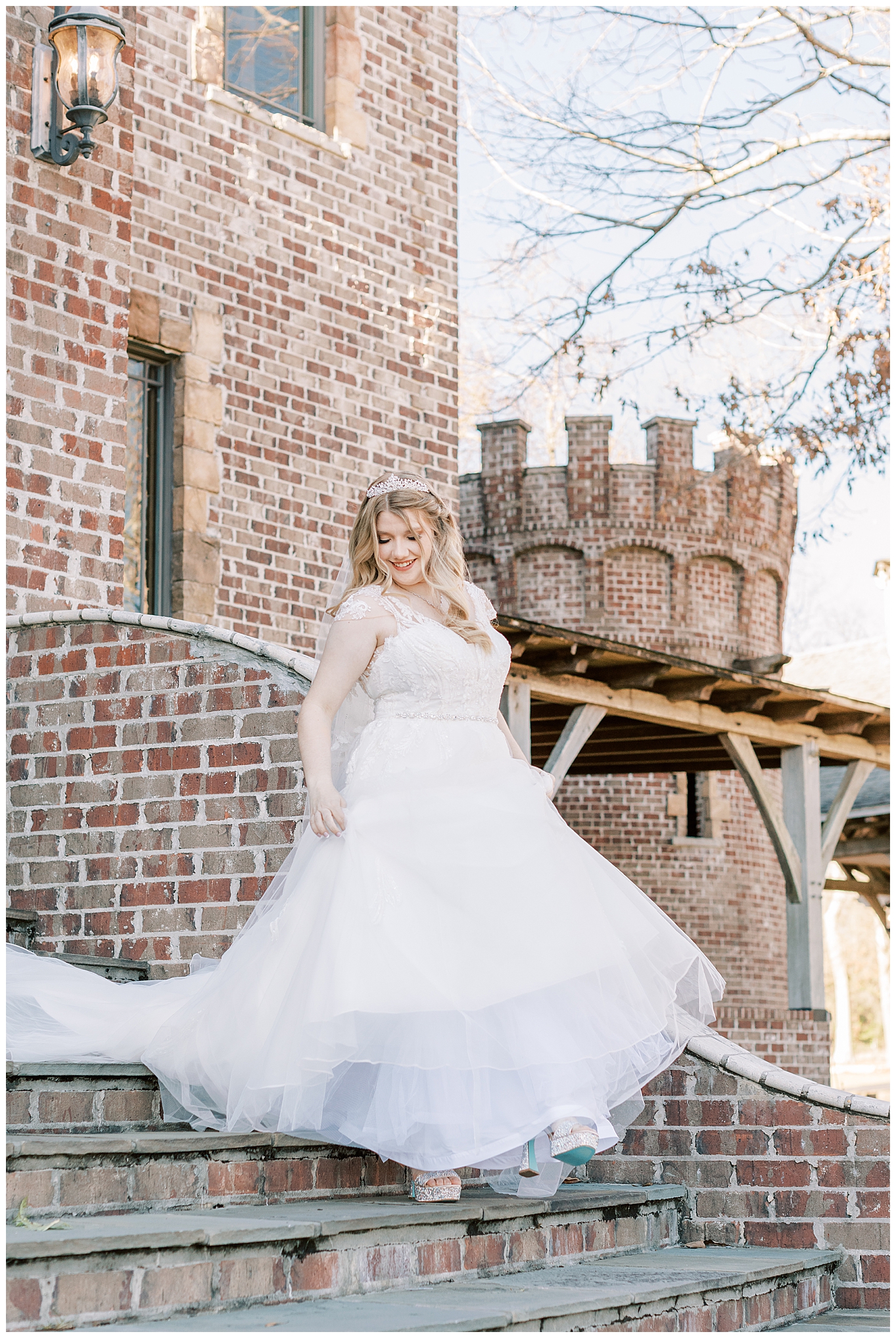 A bride walks down the steps at Three Lakes Manor.
