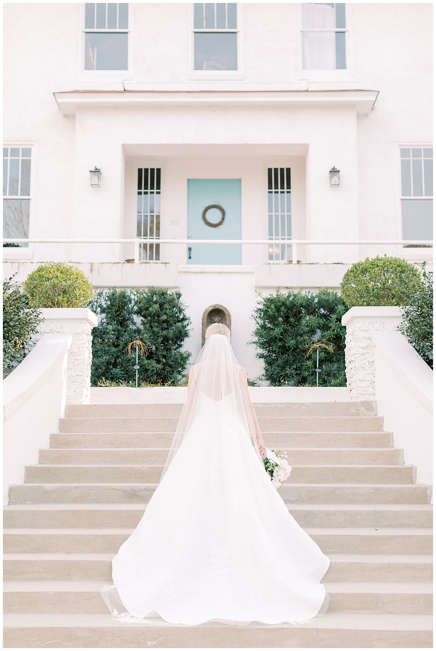 A bride walks up the steps.