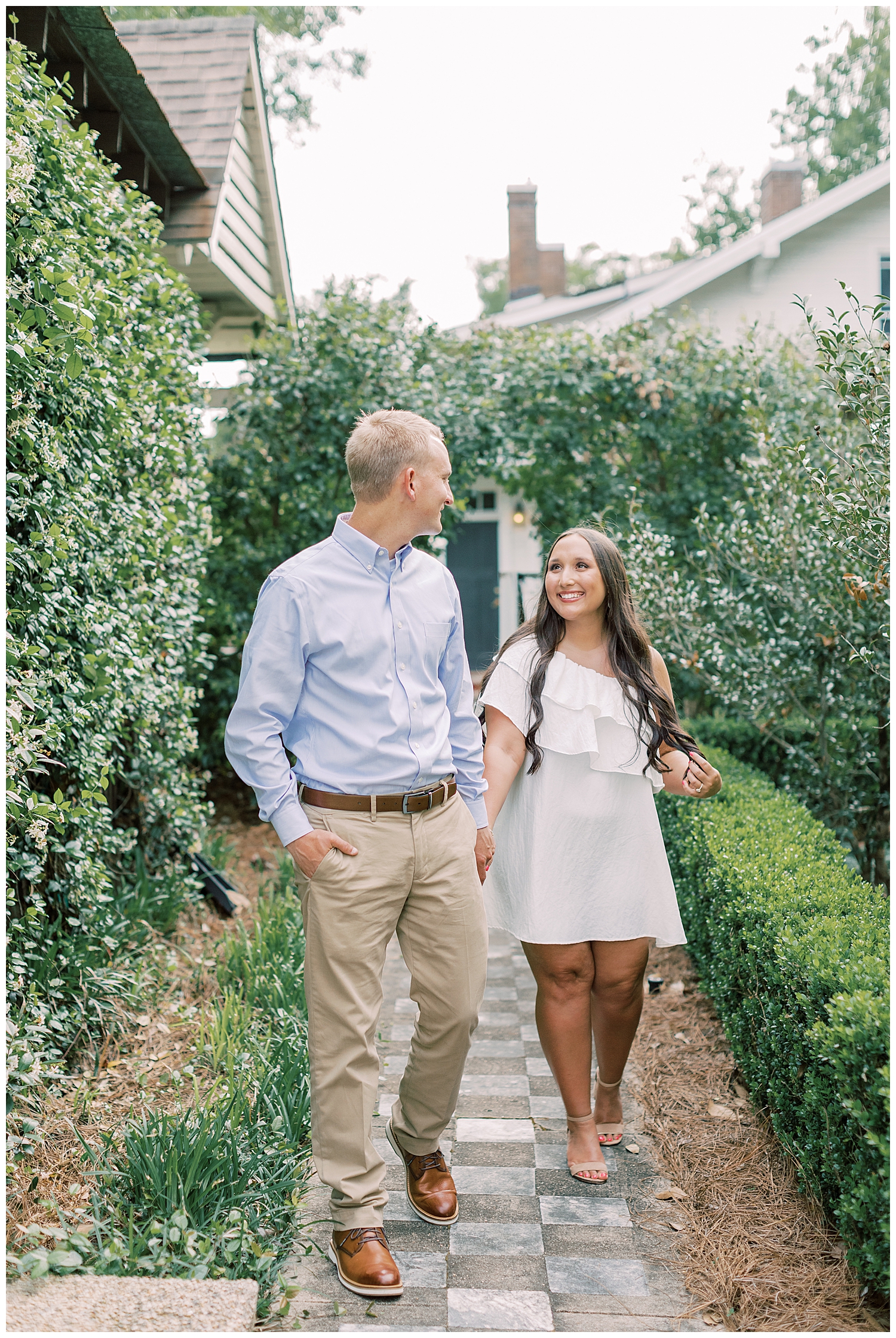 A couple walks for their Hattiesburg engagement session.