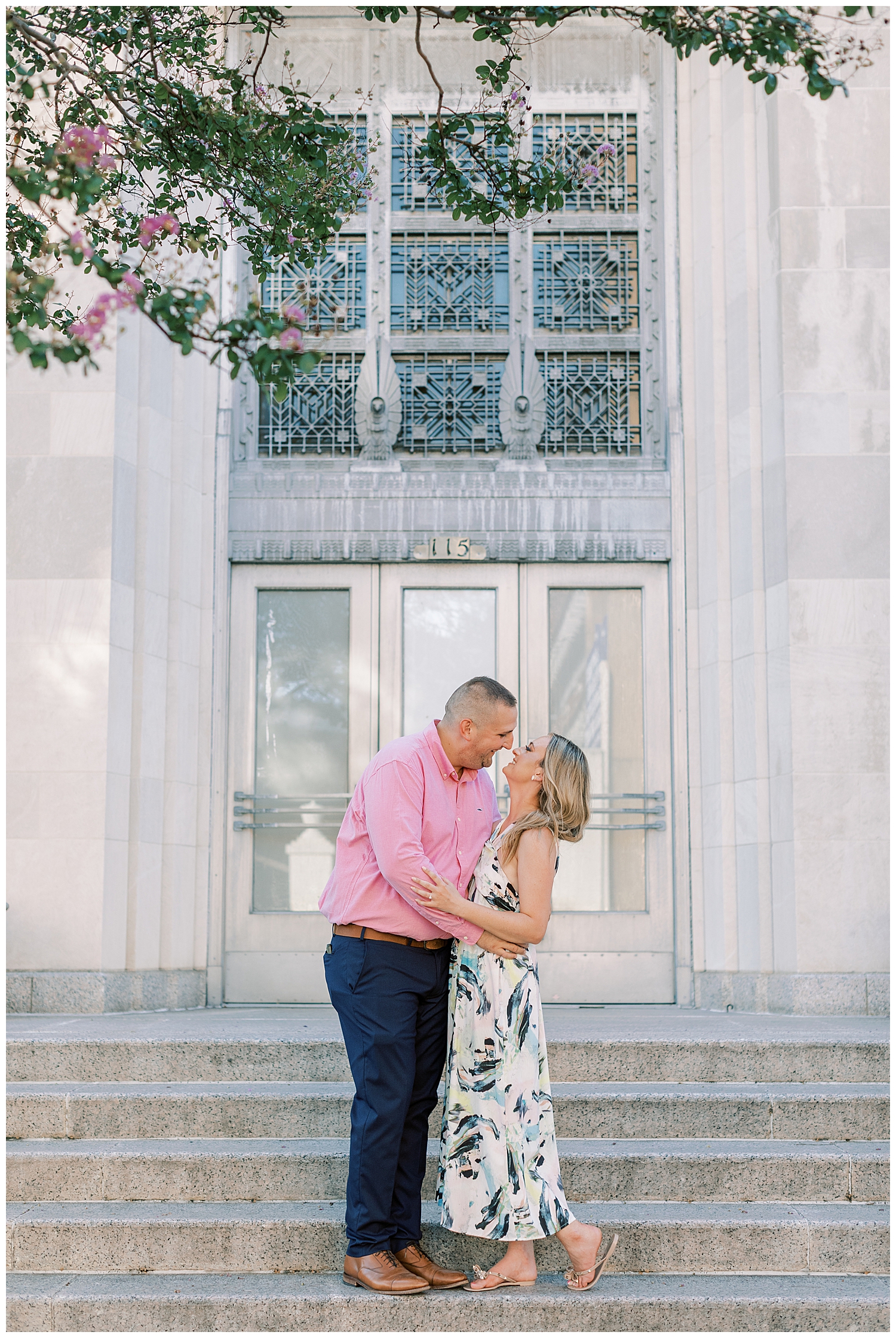 A couple stands on the steps for their downtown Hattiesburg session.